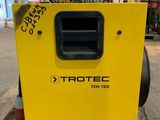 a close up of a yellow box sitting on top of a pallet