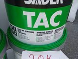 two buckets of paint sitting on a table with a price tag