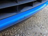 a close up of a car ' s front bumper