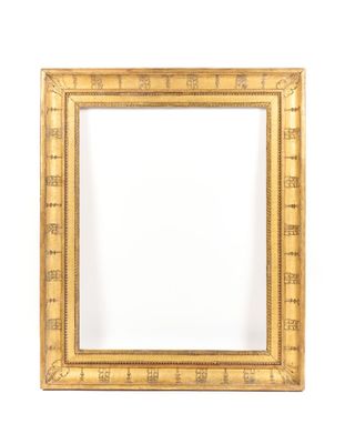 an antique gold frame with a decorative pattern and a white background