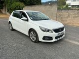 a picture of a white car parked on the side of the road