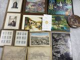 a lot of framed pictures on the floor of this room