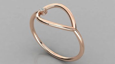 a rose gold ring with a diamond in the middle