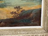 a picture of a painting in a frame on the wall