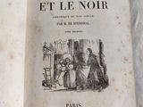 an old book with a picture of a woman and a child
