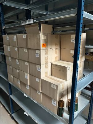 many boxes on the shelves in the warehouse