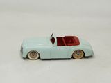 a toy car that is sitting on a white surface