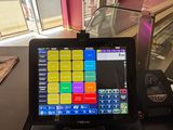 a tablet computer sitting on top of a black table
