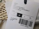a tag on a pillow with a price tag attached to it