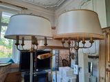 two lamps that are sitting on a table in a room