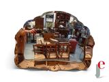 a large mirror that has a picture of a person in it