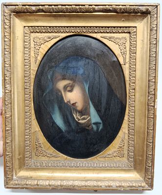 painting of a woman with a pipe in her mouth in a gold frame