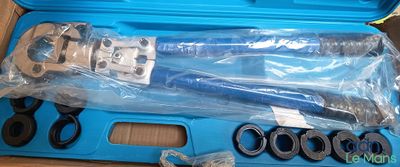 a blue case with tools inside of it on a table