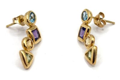 two pairs of gold earrings with multi colored stones on them