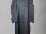 an image of a black coat on a mannequin mannequin stand