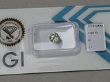 a diamond that is sitting on top of a card