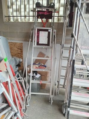 a ladder that is leaning against a wall in a garage