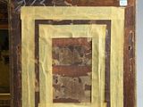pair of framed paintings of a man and a woman with a dog