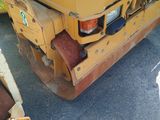 a yellow machine that is sitting on the ground