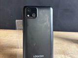 a close up of a cell phone on a wooden table