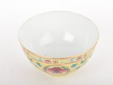 a white bowl with a design on it on a white surface
