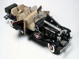 a model of a black car with a tan interior