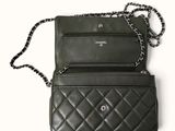 a black purse with a chain hanging from it