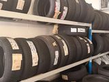 a lot of tires on the shelves in the store