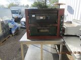an image of a table with two ovens on it