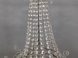 chandelier made of glass beads and crystals hanging from a ceiling