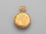 une montre de poche ancienne en or, dont le cadran est orné d'un motif floral