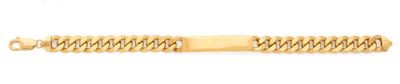 gros plan d'un bracelet en or sur fond blanc