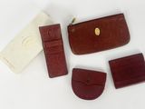 several pieces of leather are laid out on a white surface