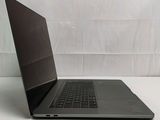 a laptop that is sitting on a white table