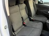 two seats in the back of a van with the door open