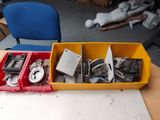 two bins of assorted items sitting on a table