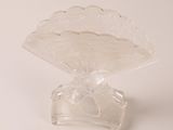 a clear glass vase with a flower inside of it