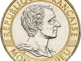 un gros plan d'une pièce de monnaie à l'effigie d'une femme
