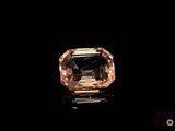 a close up of a diamond on a black surface