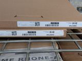 boxes are stacked on top of each other on a shelf