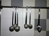 spoons and spoon spoons hanging from a rack
