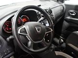 dashboard view of a car with a steering wheel and dashboard controls