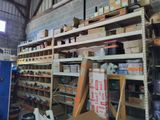 a room filled with lots of boxes and shelves