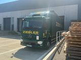 a truck that is parked in front of a building