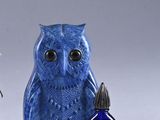 three blue and white owl figurines sitting next to each other