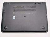 a black laptop with a small battery on it