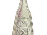 silver spoon with a crown on it sitting on a white surface