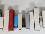 a lot of toy trains that are lined up on a table