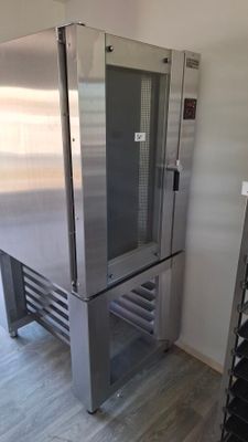 a large stainless steel refrigerator in the corner of a room
