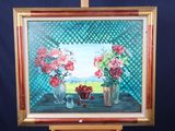 a painting of flowers in vases on a easel